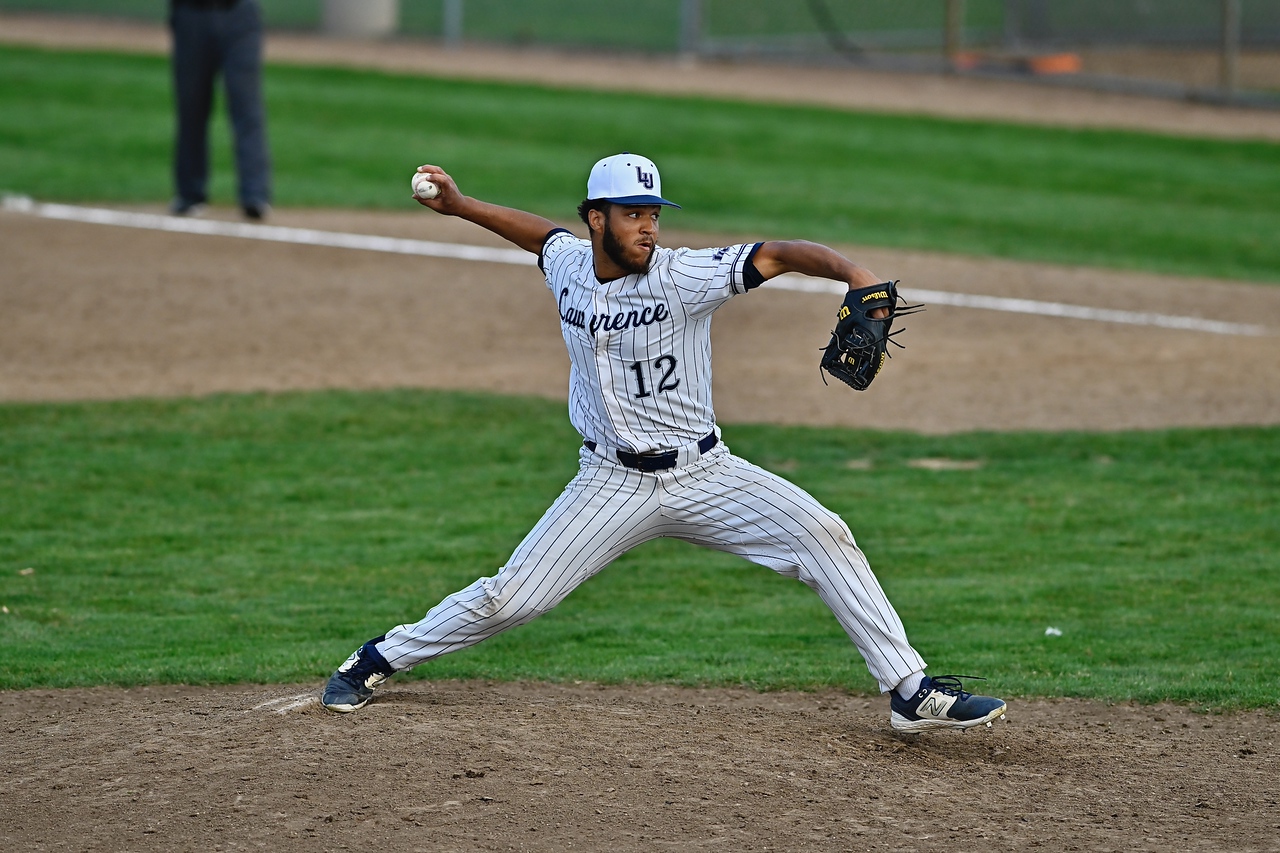 student-athlete pitching baseball